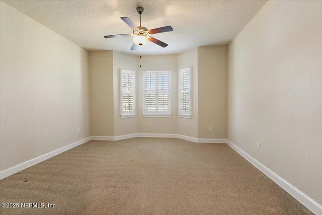 a bathroom with a shower sink and mirror
