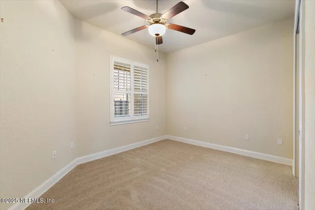 a view of an house with backyard and trees
