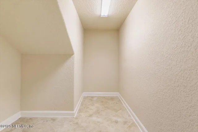 a front view of a house with a lake view