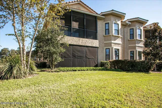 a view of a livingroom with furniture and a flat screen tv