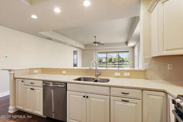 a room with a refrigerator and cabinets