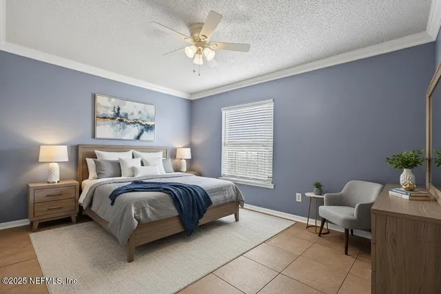 a spacious bedroom with a bed and a chandelier