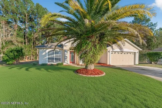 a view of a house with a yard