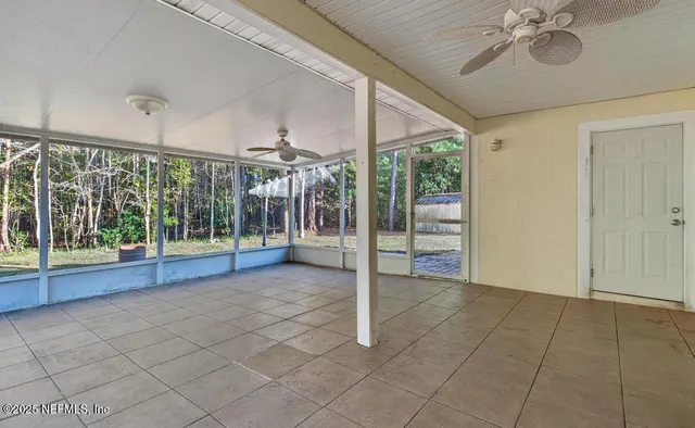 a view of an entryway with a ceiling fan