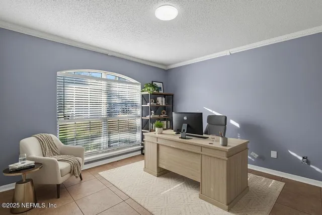 a work room with furniture and a window