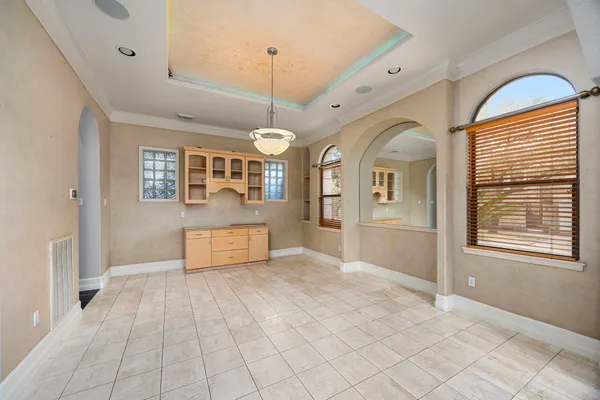 a view of a hallway with a chandelier