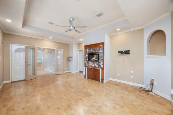 a spacious bathroom with a granite countertop sink a mirror a bathtub and shower