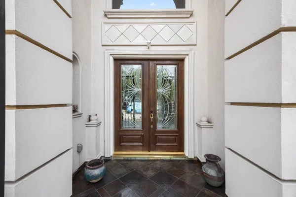 a view of a room with rack on the wall and a window