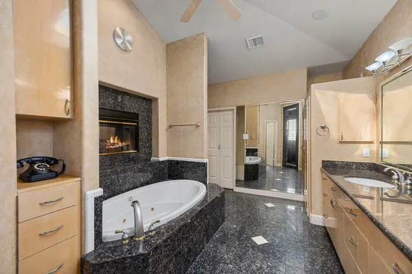 a bathroom with a double vanity sink and mirror
