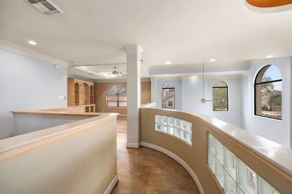 a kitchen with white cabinets and black appliances