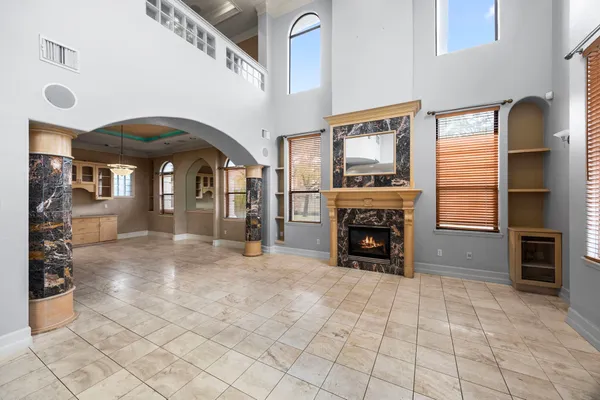 a view of livingroom with furniture fireplace and window