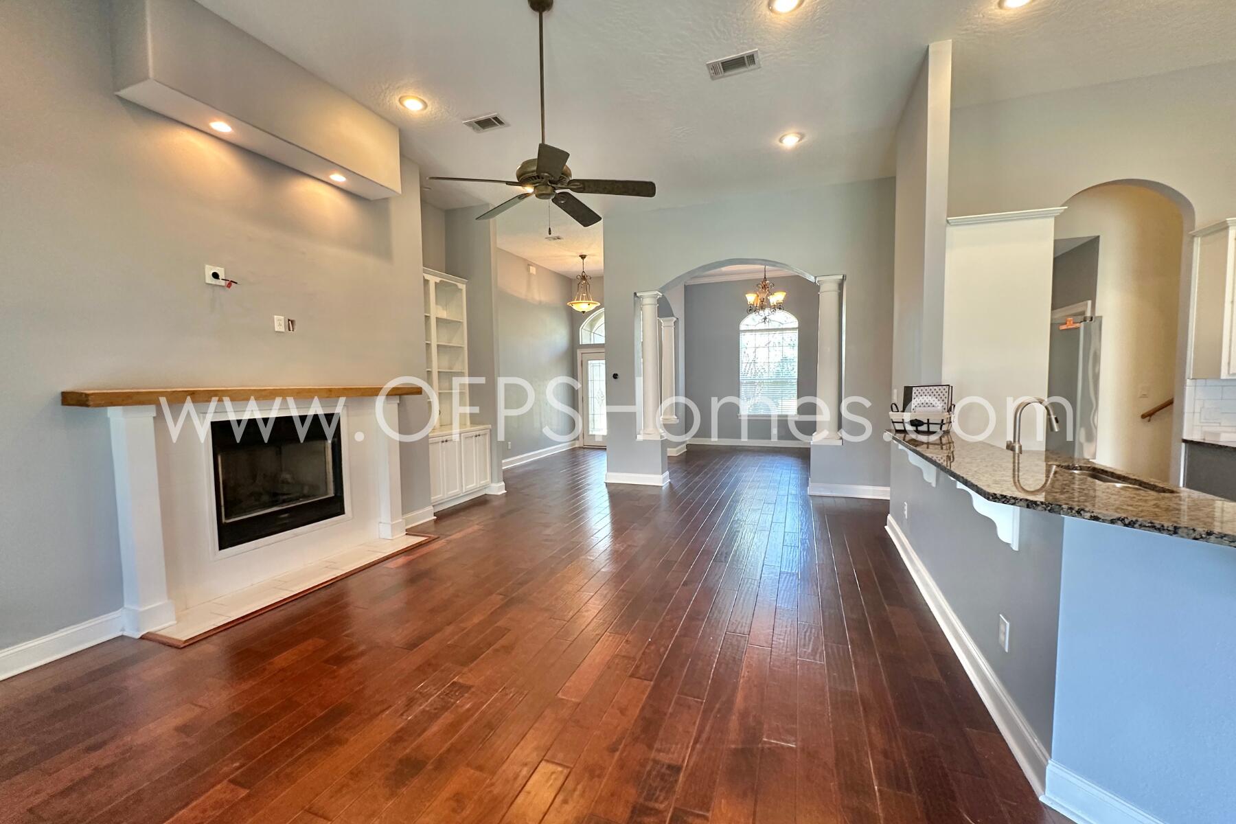 4611 Chanan Drive Crestview, FL 32539 - Photo 13 of 36 a view of a living room a fireplace with wooden floor
