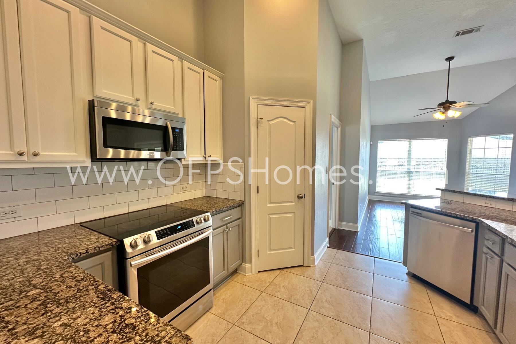 4611 Chanan Drive Crestview, FL 32539 - Photo 16 of 36 a kitchen with stainless steel appliances granite countertop a stove a sink and a granite counter tops