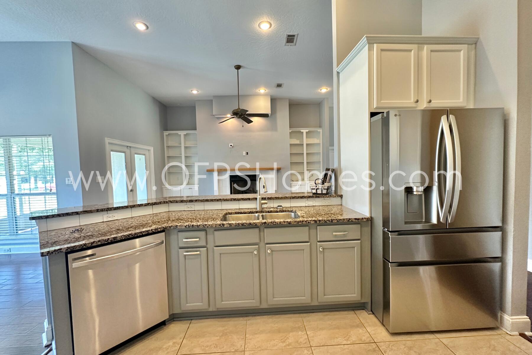 4611 Chanan Drive Crestview, FL 32539 - Photo 18 of 36 a kitchen with stainless steel appliances granite countertop a refrigerator sink and cabinets