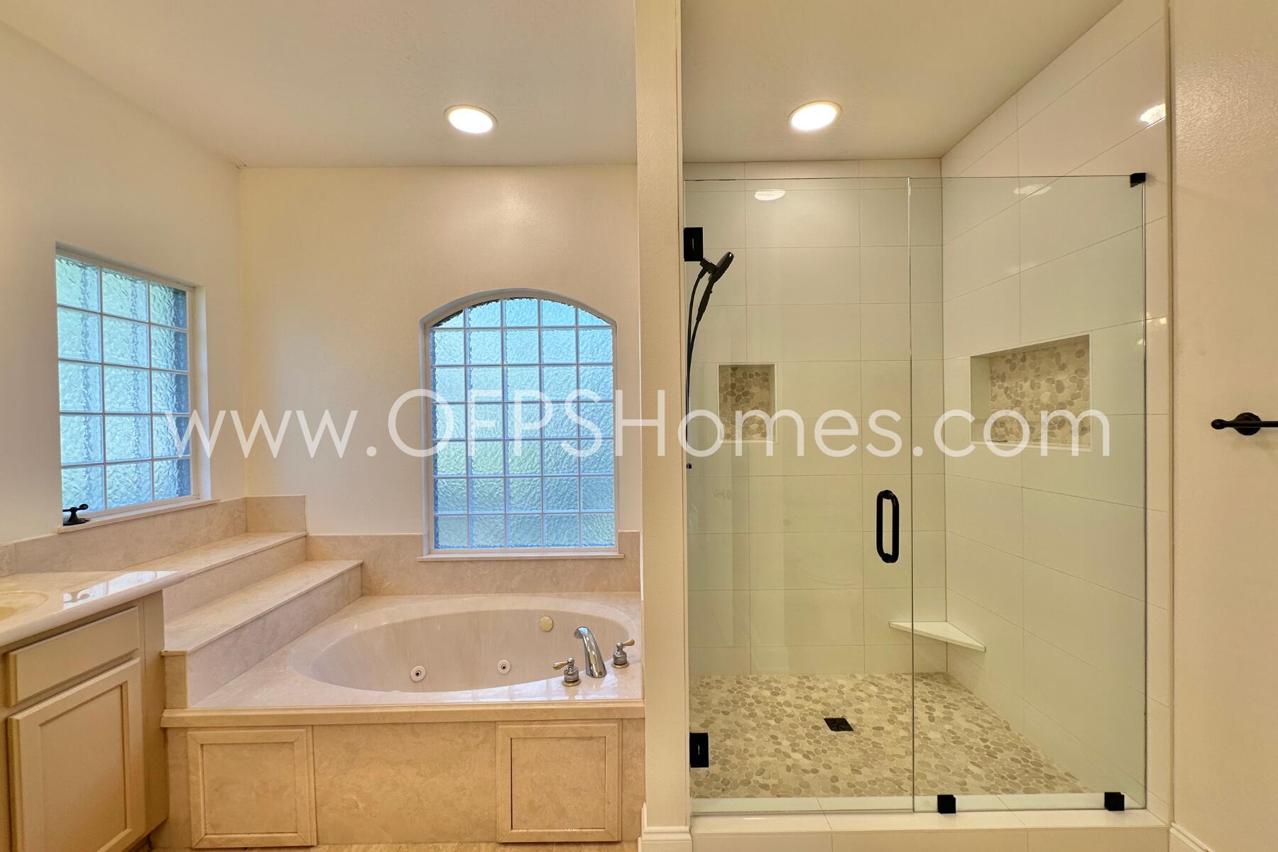 4611 Chanan Drive Crestview, FL 32539 - Photo 27 of 36 a bathroom with a tub a sink and a shower
