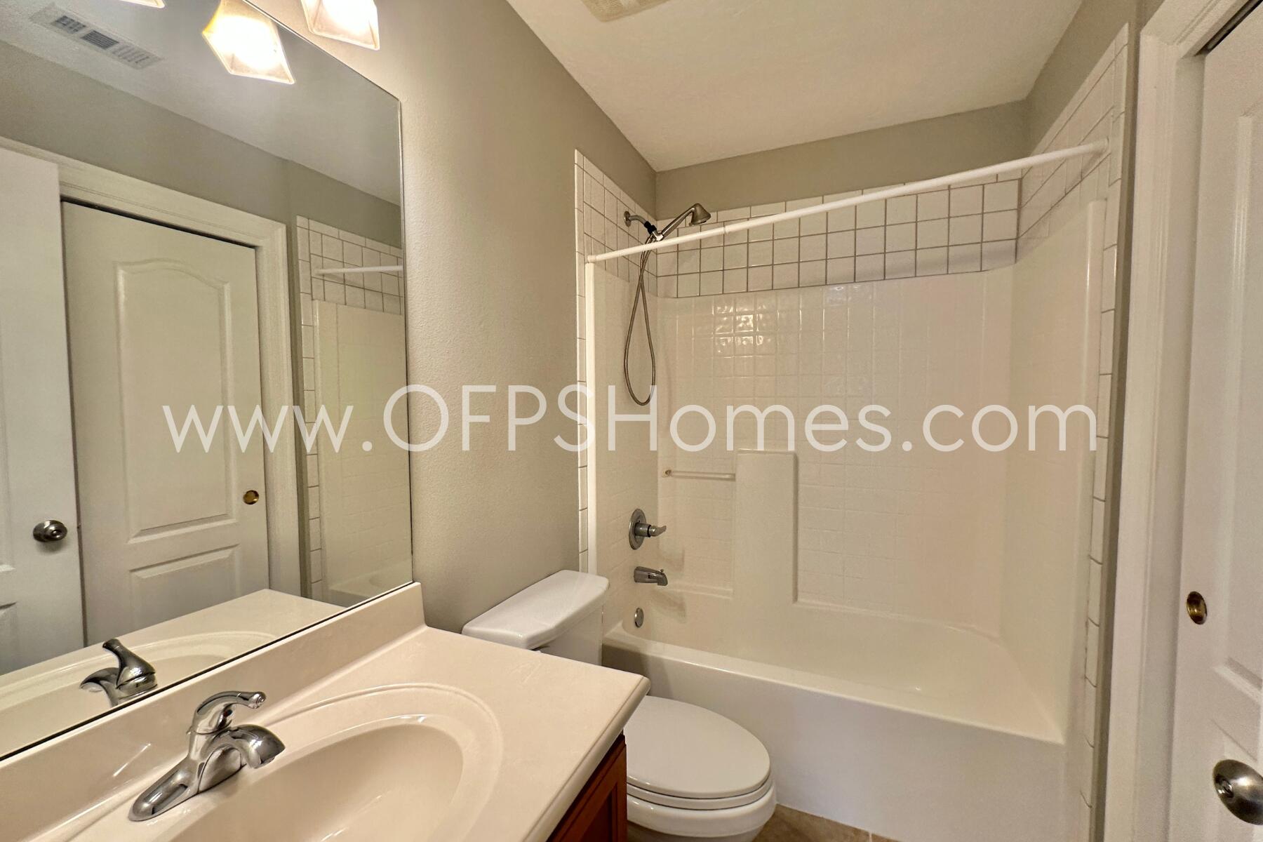 4611 Chanan Drive Crestview, FL 32539 - Photo 32 of 36 a bathroom with a sink toilet and shower