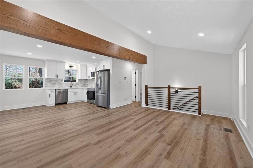 4190 Heather Way Cumming, GA 30041 - Photo 11 of 45 a view of a kitchen with a sink and a refrigerator