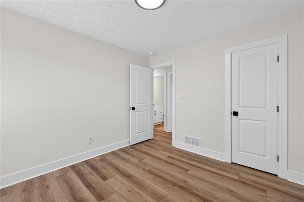 4190 Heather Way Cumming, GA 30041 - Photo 23 of 45 a view of room with wooden floor