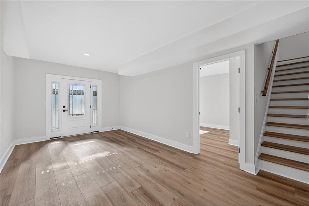 4190 Heather Way Cumming, GA 30041 - Photo 24 of 45 a view of an empty room with wooden floor and entryway