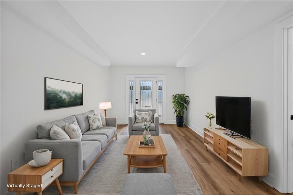 4190 Heather Way Cumming, GA 30041 - Photo 25 of 45 a living room with furniture and a flat screen tv