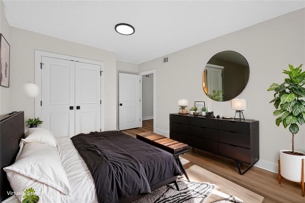 4190 Heather Way Cumming, GA 30041 - Photo 31 of 45 a bedroom with bed and a large mirror