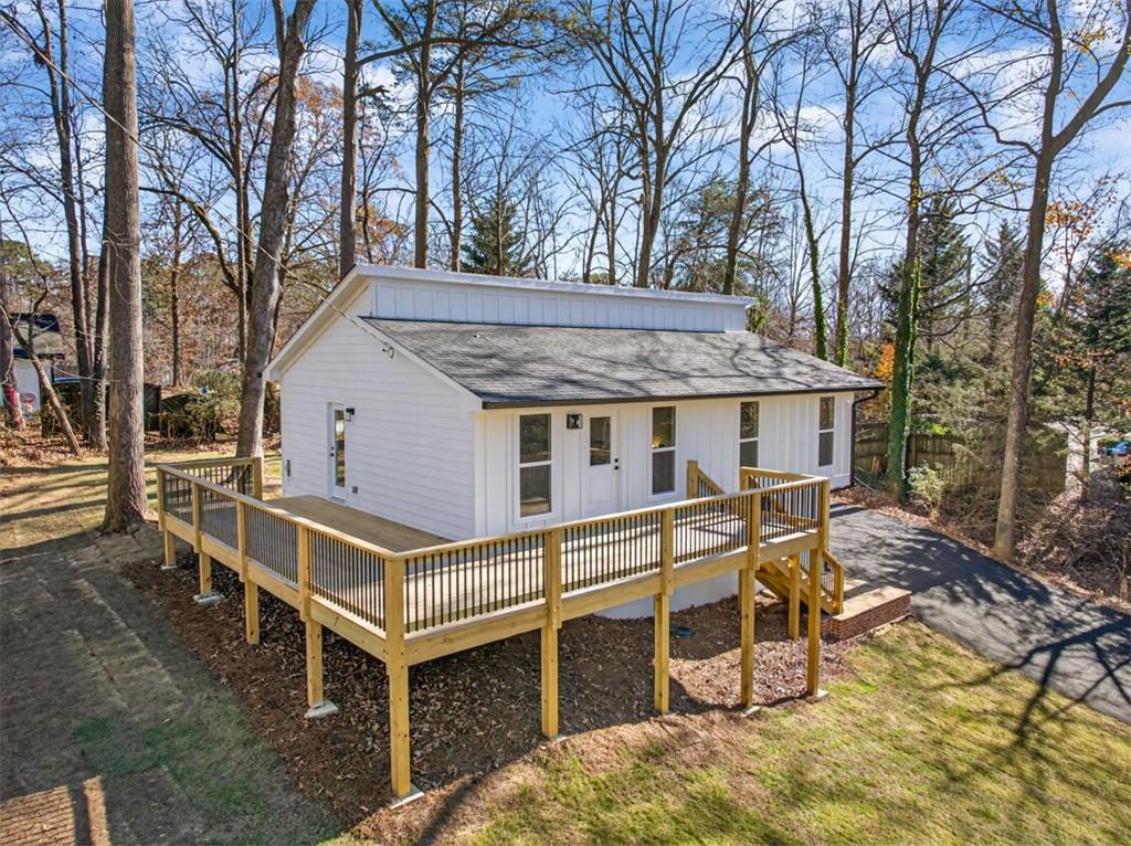 4190 Heather Way Cumming, GA 30041 - Photo 5 of 45 a view of a house with backyard and sitting area