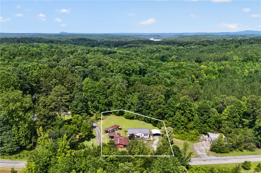 418 Chauga Road Westminster, SC 29693 - Photo 31 of 38 Perched on a verdant hillside, this property offers serene, expansive views of the distant landscape.