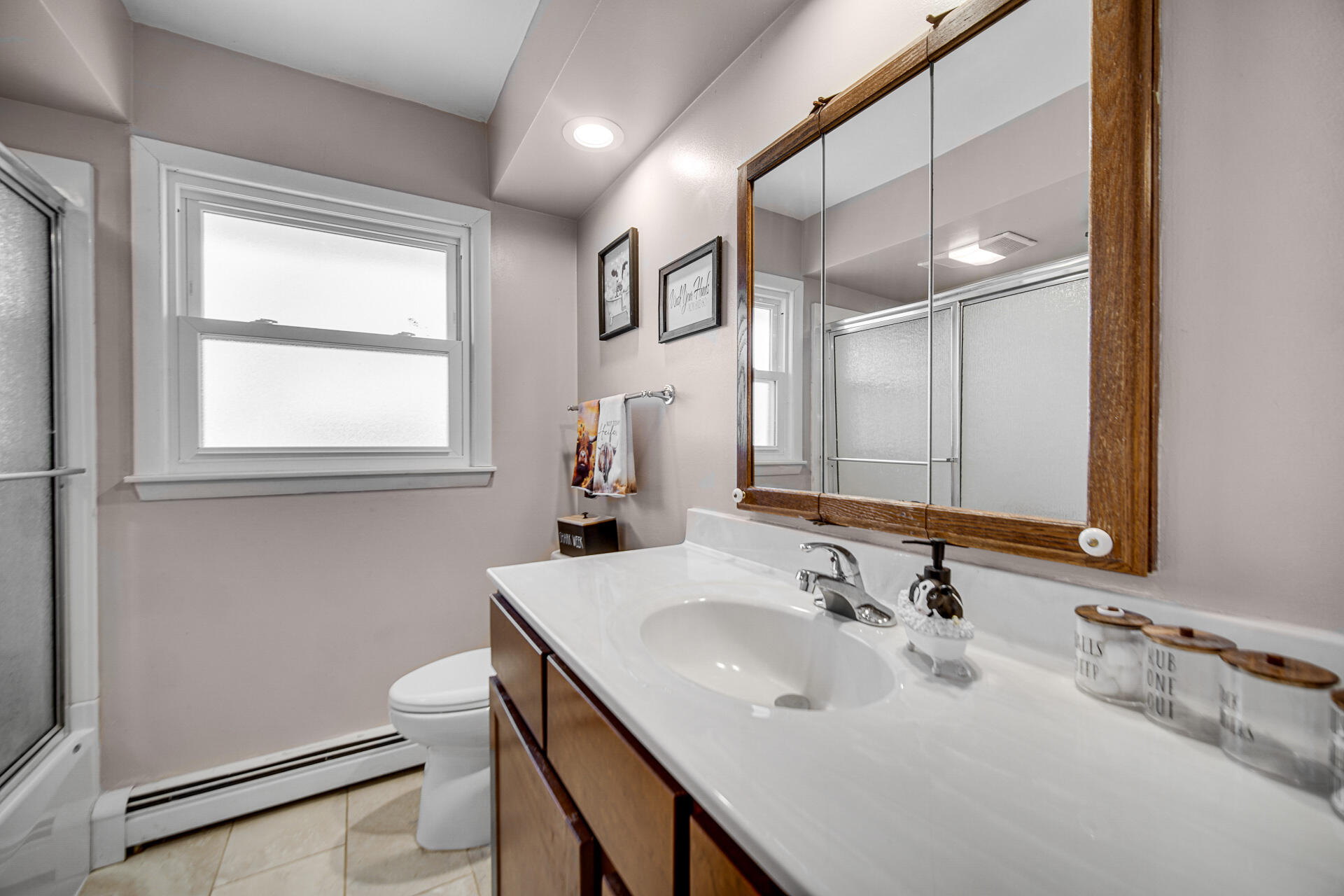 612 Almond Street Northwest De Motte, IN 46310 - Photo 12 of 27 a bathroom with a sink and a mirror