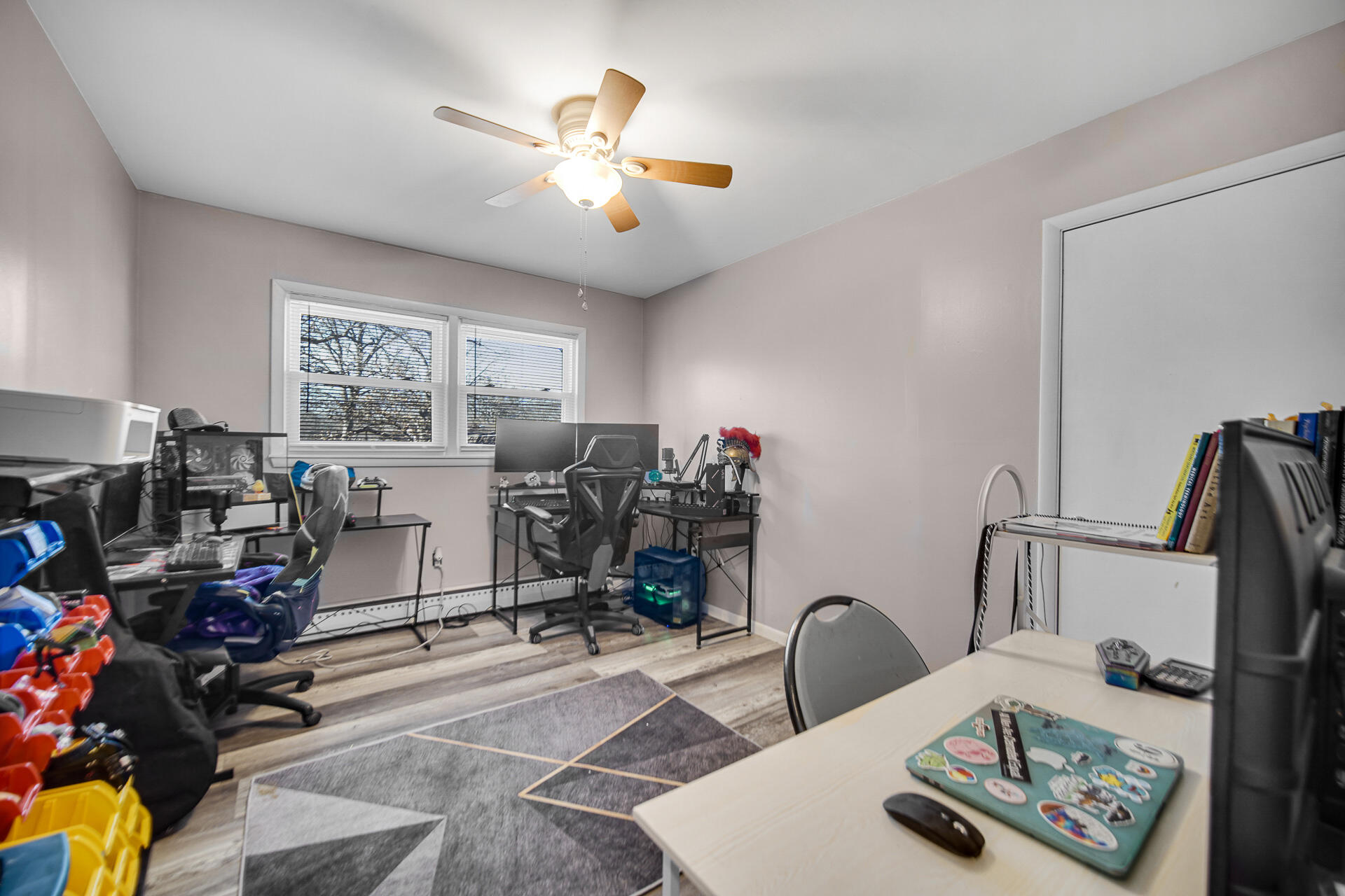 612 Almond Street Northwest De Motte, IN 46310 - Photo 13 of 27 a view of a workspace with furniture and toys