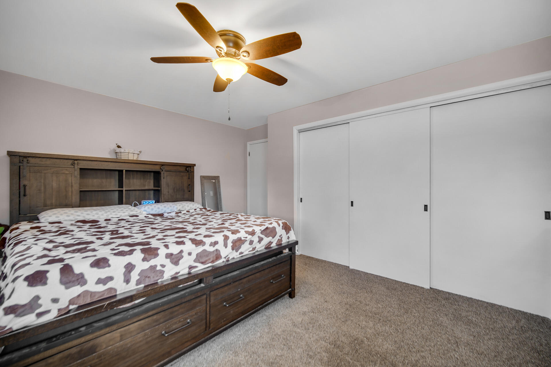 612 Almond Street Northwest De Motte, IN 46310 - Photo 15 of 27 a bedroom with a bed and a large window