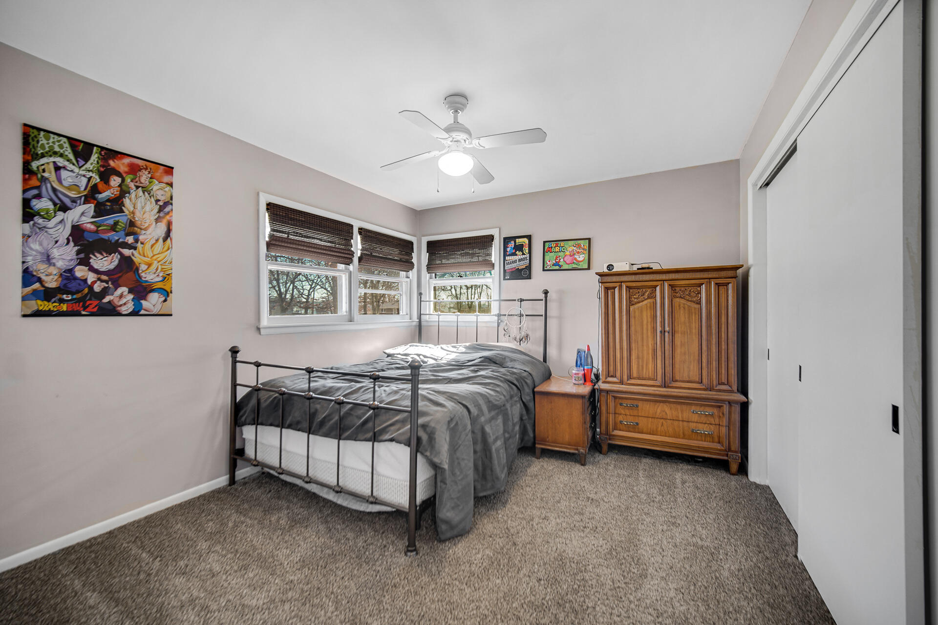 612 Almond Street Northwest De Motte, IN 46310 - Photo 16 of 27 a bedroom with a bed and a painting on the wall