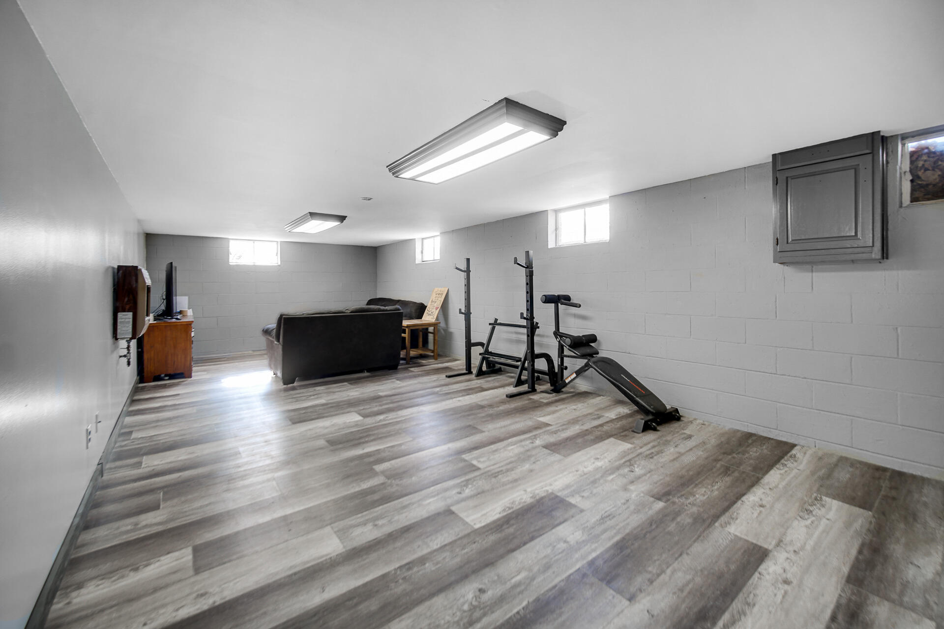 612 Almond Street Northwest De Motte, IN 46310 - Photo 17 of 27 a view of a room with gym equipment and windows