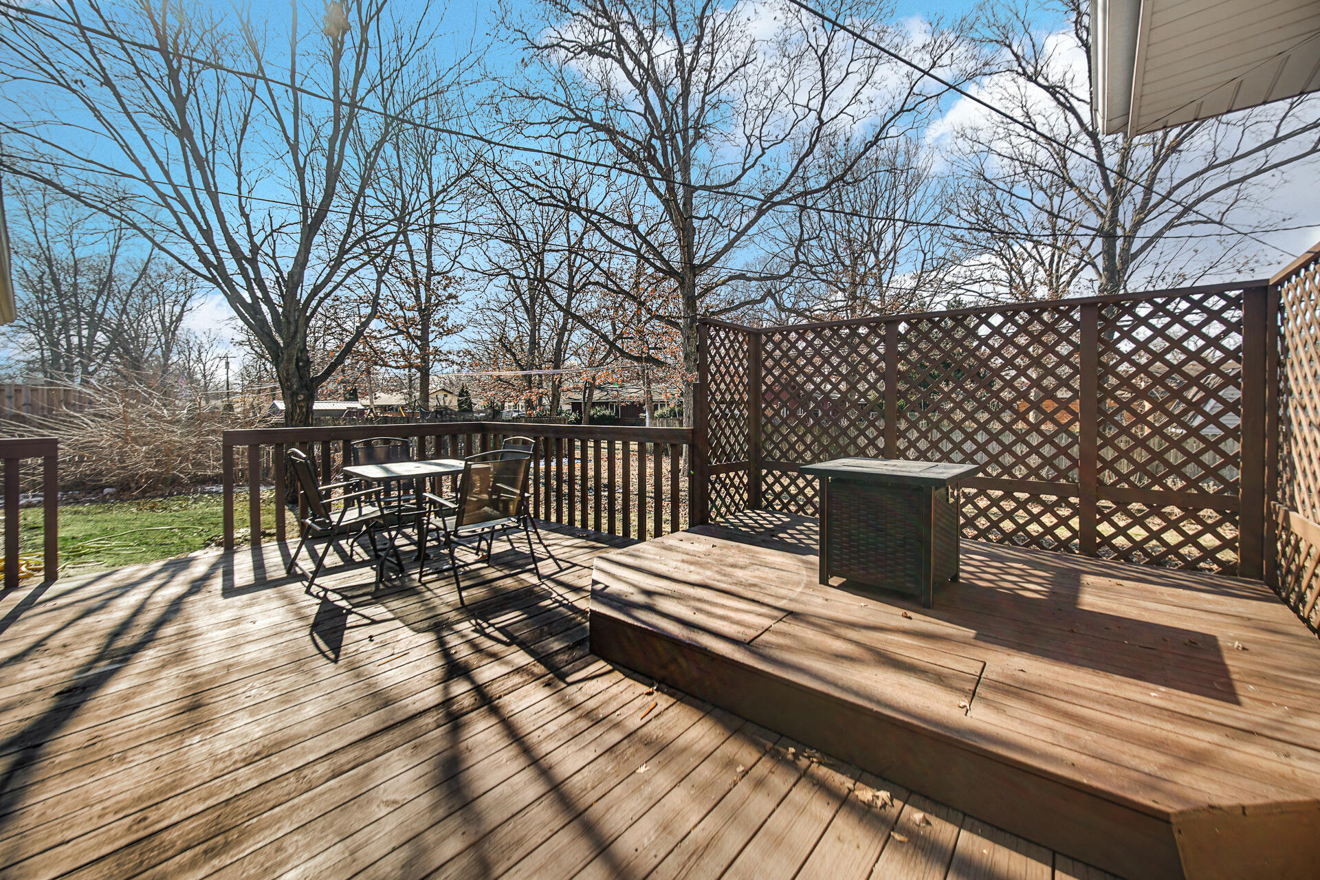 612 Almond Street Northwest De Motte, IN 46310 - Photo 24 of 27 a view of a deck with wooden floor and fence