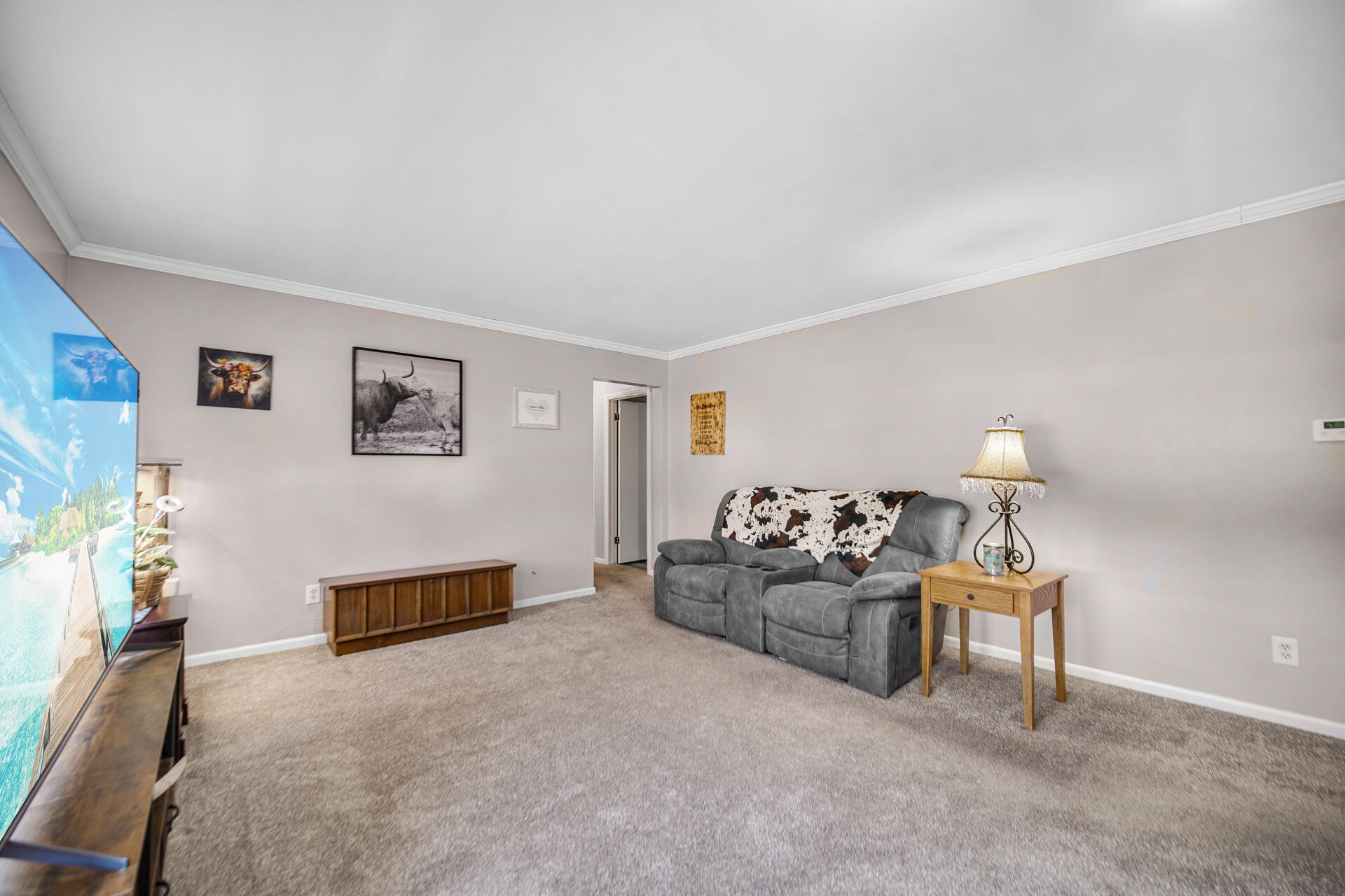 612 Almond Street Northwest De Motte, IN 46310 - Photo 5 of 27 a living room with furniture and a lamp