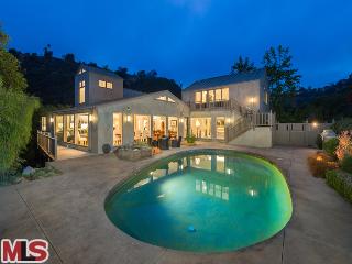 930 Chantilly Road Los Angeles, CA 90077 - Photo 1 of 1 a view of a swimming pool with a yard in front of it