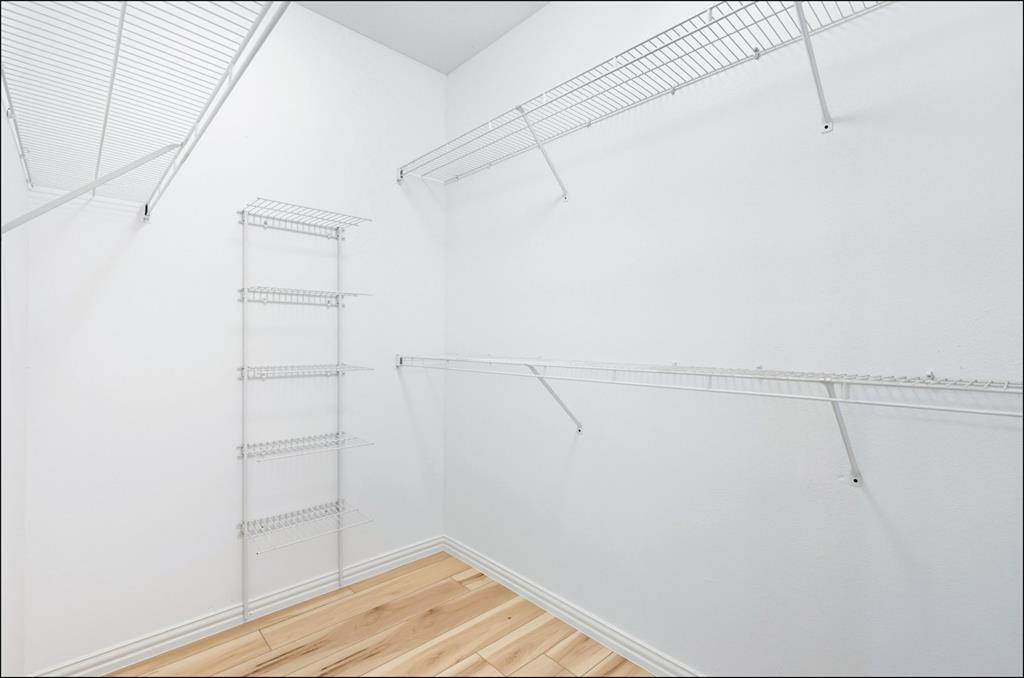 2601 Preston Road, Unit 1201 Plano, TX 75093 - Photo 11 of 28 a view of a room with racks on the wall