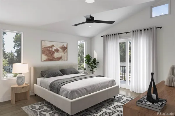 a bedroom with a large bed and a window