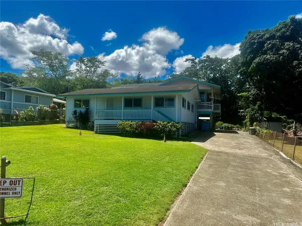 a view of house with yard and green space