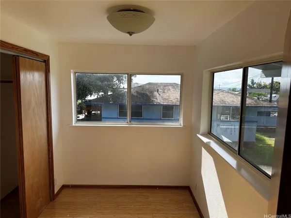 a view of an empty room with a window