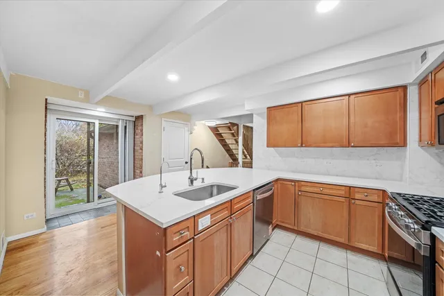 a kitchen with a sink stove and cabinets