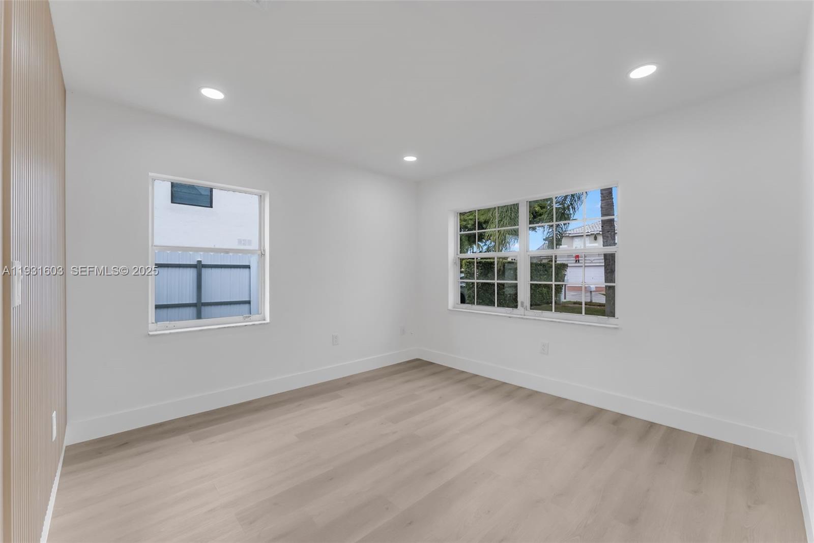 16054 Southwest 77th Terrace Miami, FL 33193 - Photo 11 of 42 an empty room with a window