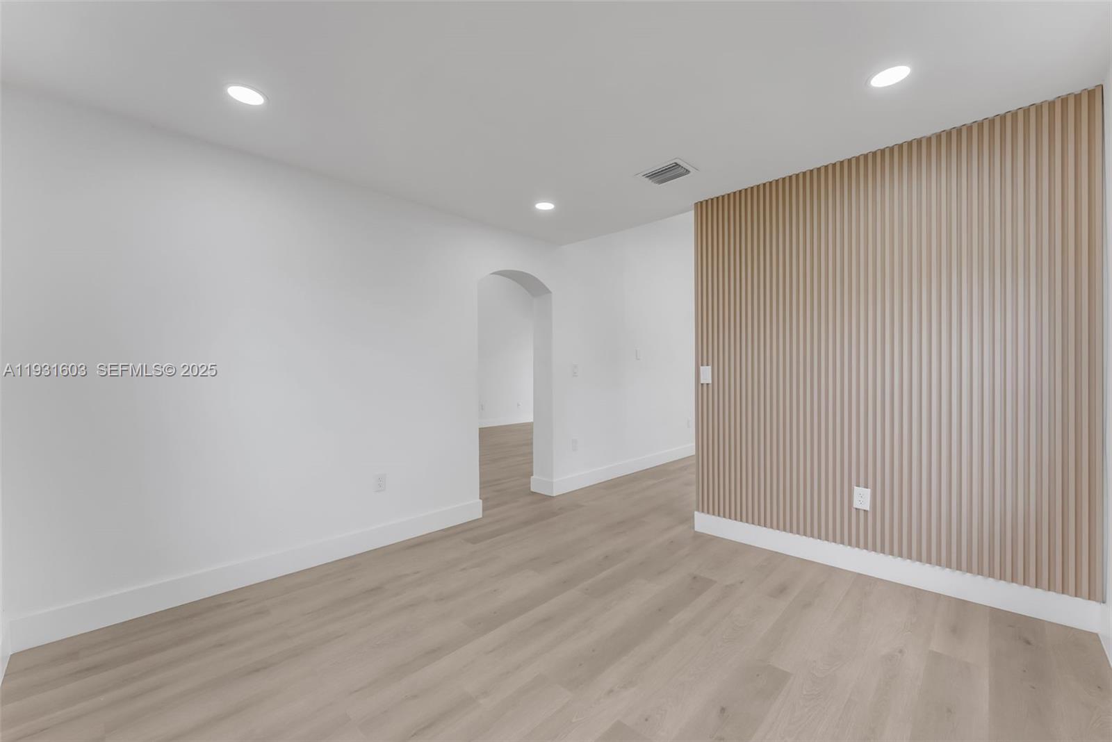 16054 Southwest 77th Terrace Miami, FL 33193 - Photo 12 of 42 an empty room with wooden floor and windows