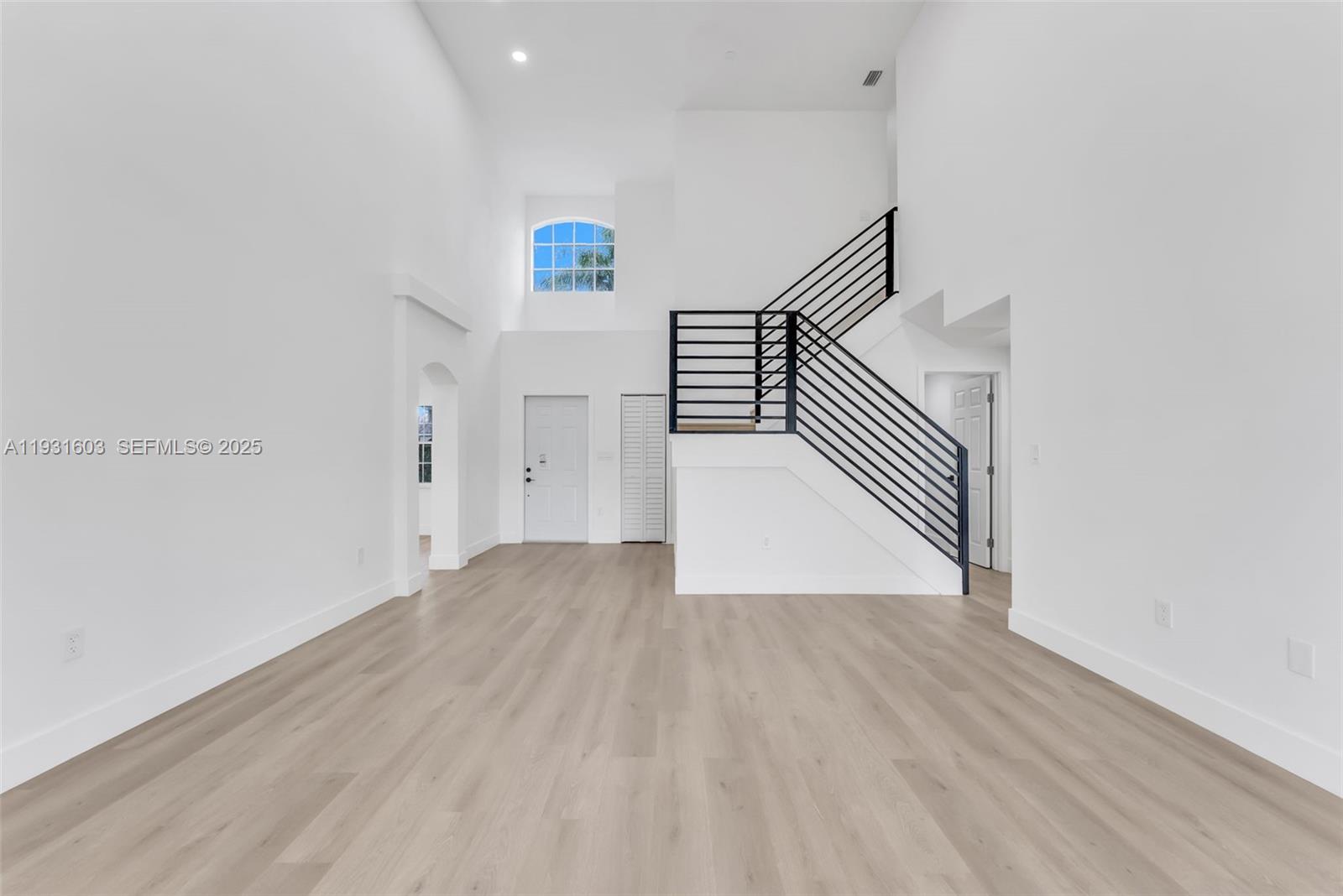 16054 Southwest 77th Terrace Miami, FL 33193 - Photo 16 of 42 a view of a hallway with wooden floor