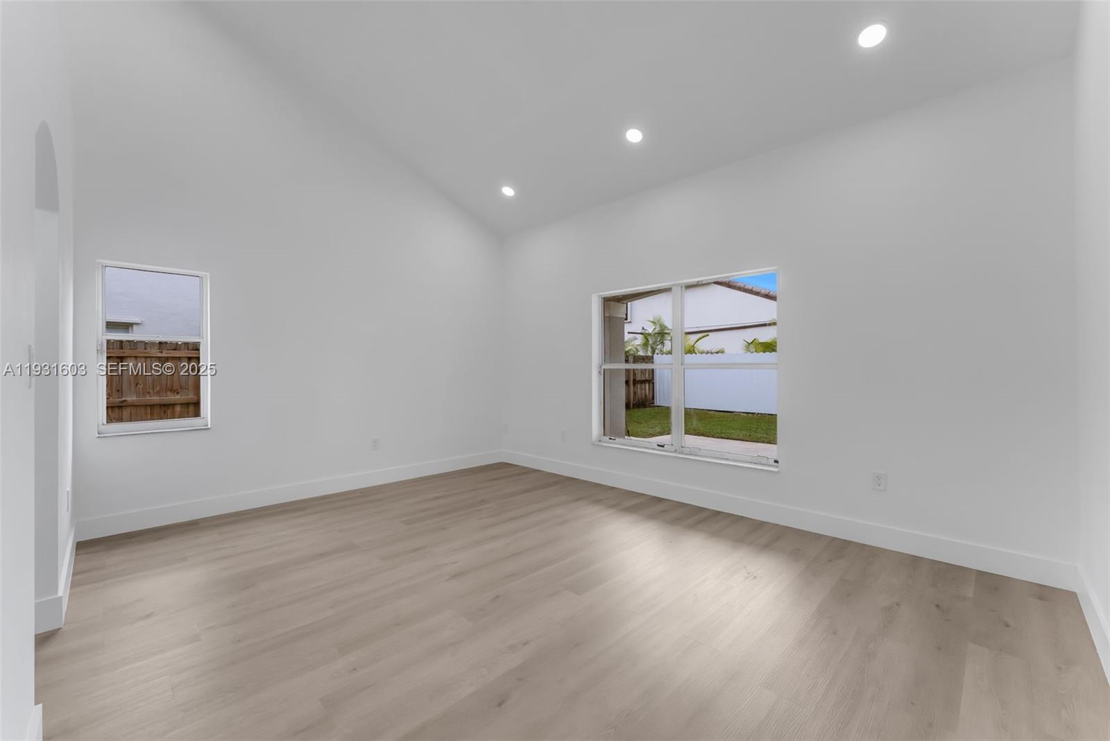 16054 Southwest 77th Terrace Miami, FL 33193 - Photo 17 of 42 an empty room with a window