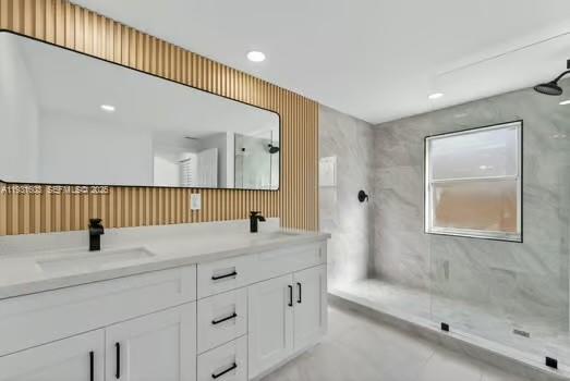 16054 Southwest 77th Terrace Miami, FL 33193 - Photo 20 of 42 a bathroom with a sink and a mirror