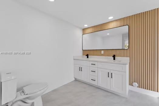 16054 Southwest 77th Terrace Miami, FL 33193 - Photo 21 of 42 a bathroom with 2 sink toilet and a mirror