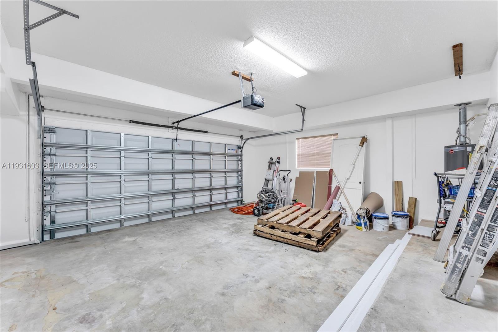 16054 Southwest 77th Terrace Miami, FL 33193 - Photo 23 of 42 a view of a garage with furniture