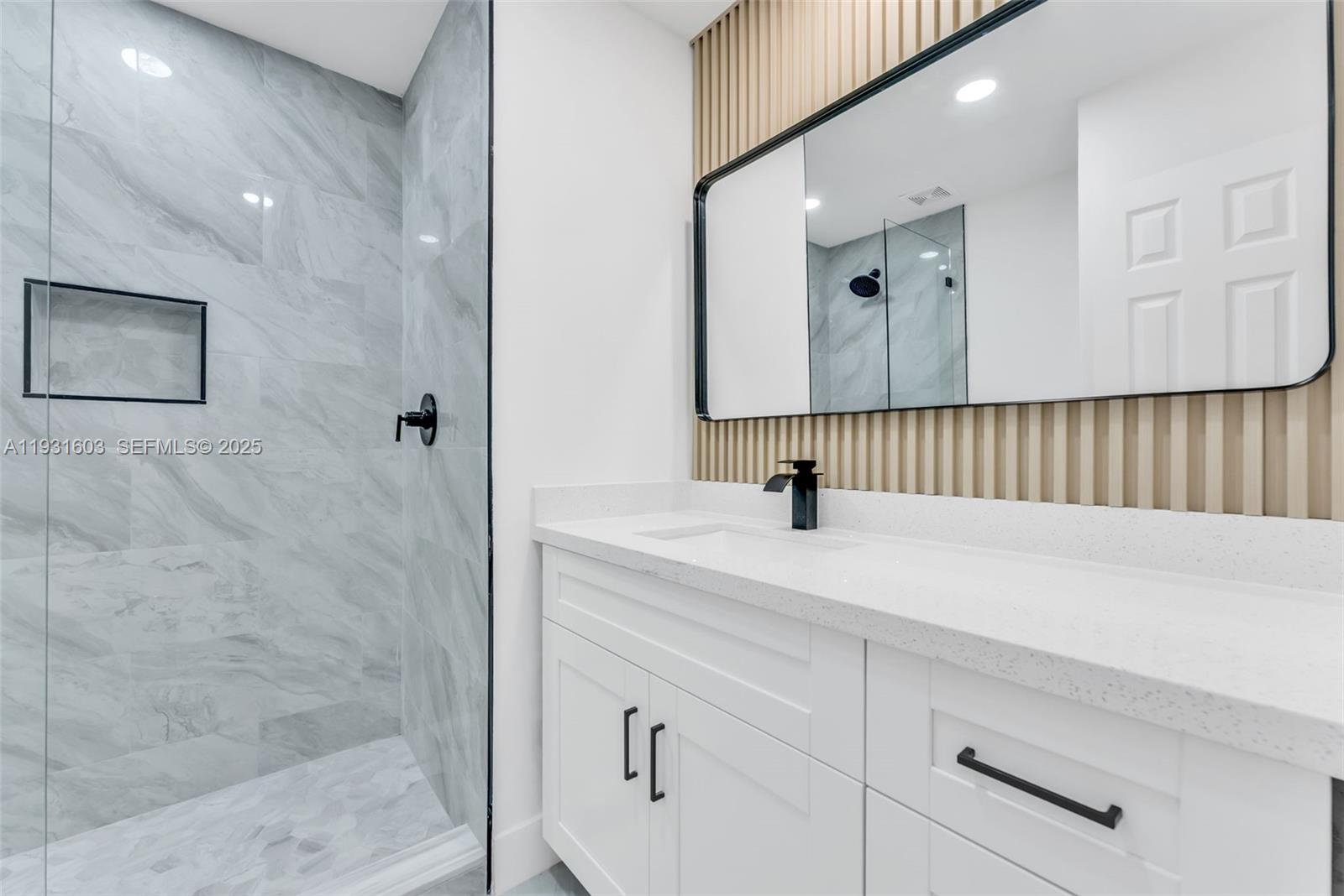 16054 Southwest 77th Terrace Miami, FL 33193 - Photo 24 of 42 a bathroom with a sink and a mirror