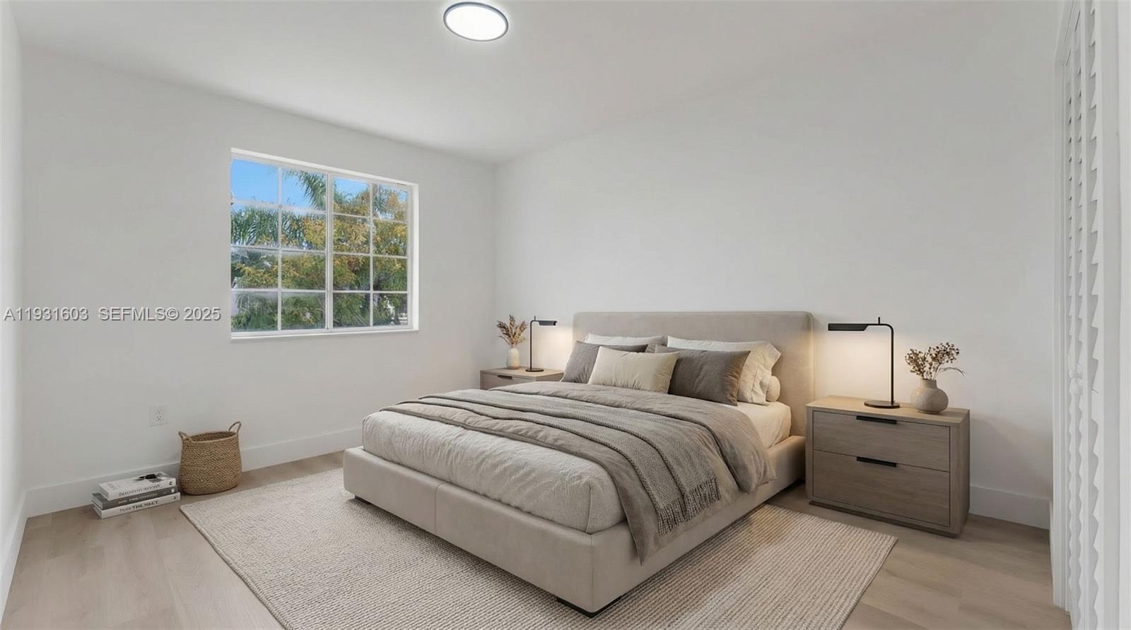 16054 Southwest 77th Terrace Miami, FL 33193 - Photo 29 of 42 a bedroom with a bed and a window