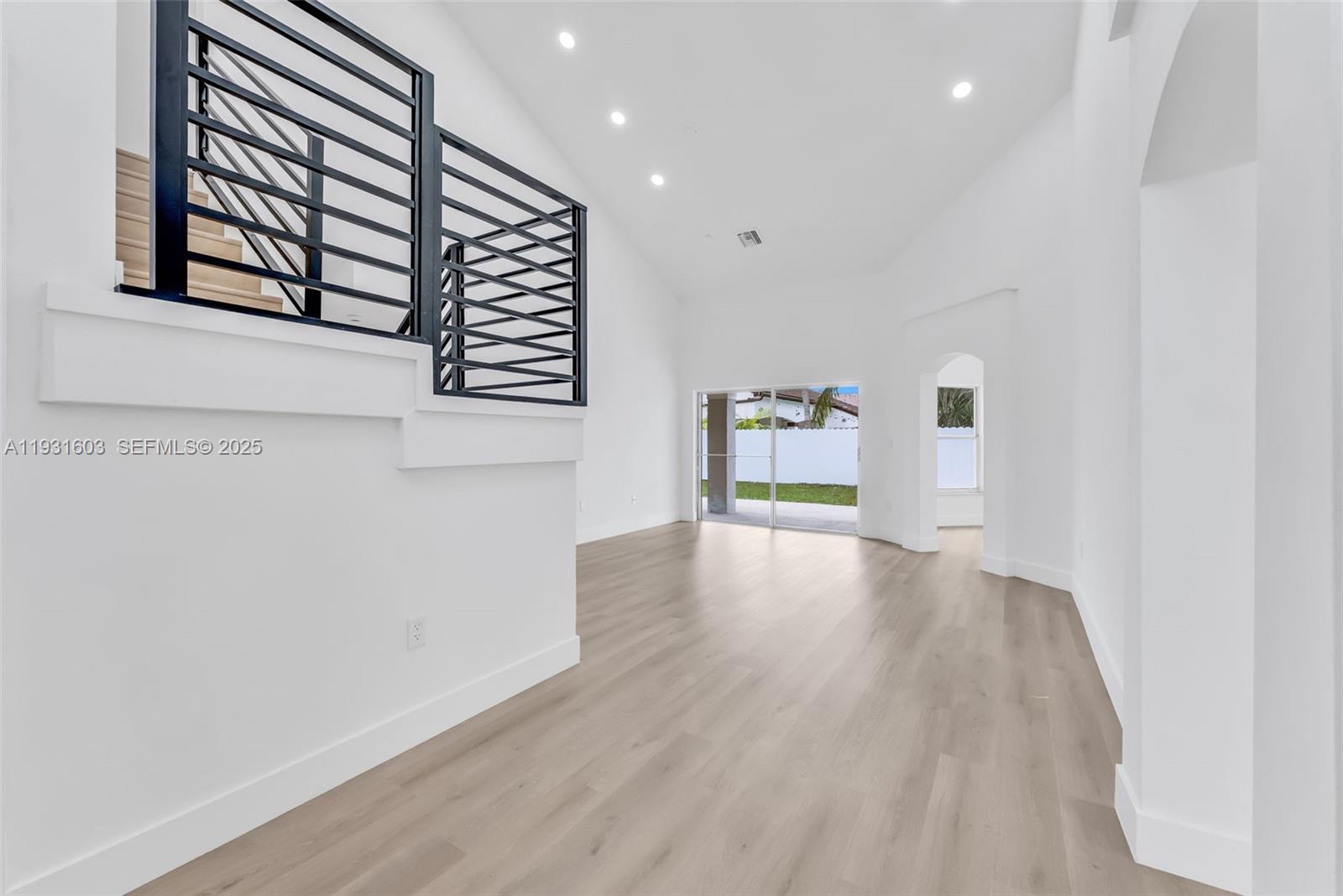 16054 Southwest 77th Terrace Miami, FL 33193 - Photo 5 of 42 a view of an empty room with a window